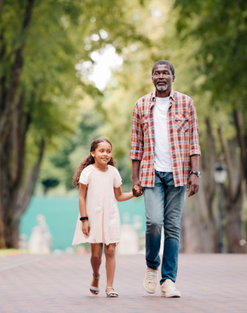 african-american-girl-holding-hands-with-grandfather-Ellis Family Law in Cary NC