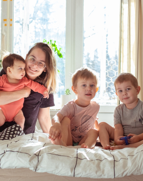 family-of-young-mother-with-three-children-in-home-cary child visitation lawyers1