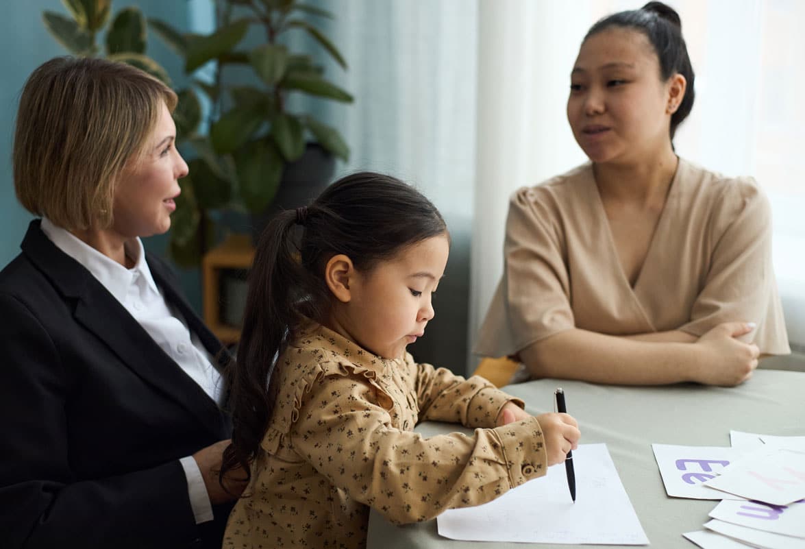 educating-young-child-with-teacher-and-parent-chapel-hill-visitation-lawyers-ellis-family