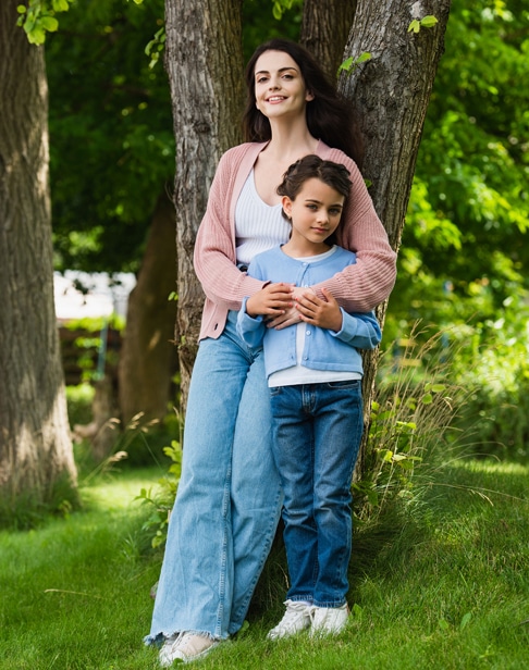 full-length-of-positive-woman-hugging-daughter-raleigh-child-support-lawyer-ellis-family