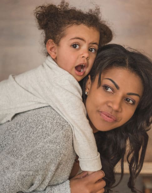 little-daughter-hugging-mother-while-spending-time-chapel-hill-child-support-ellis-family