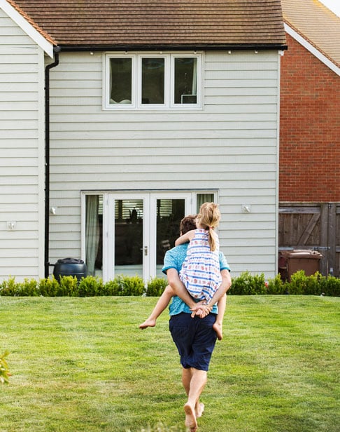 rear-view-of-a-man-walking-across-a-lawn-chapel-hill-property-division-laywer-ellis
