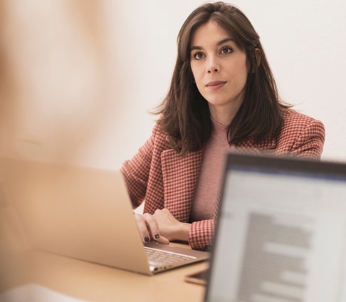 serious-women-using-laptops-at-workplace-property-division-lawyers-raleigh-ellis-family2