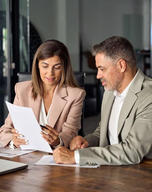 female-manager-consulting-client-with-documents-wake-forest-divorce-lawyers-ellis-family