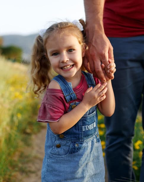 little-girl-holding-father-s-hand-child-support-ellis-family-law-wake-forest