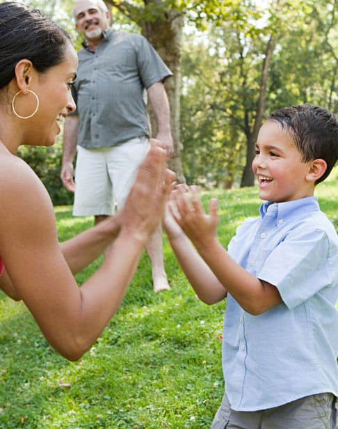 mother-playing-pat-a-cake-with-son-iwake-forest-child-custody-ellis-family