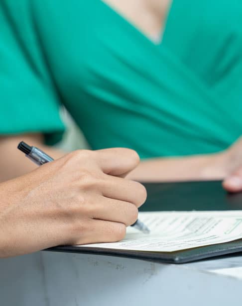 person-signing-papers-chapel-hill-prenup-lawyers-ellis-family