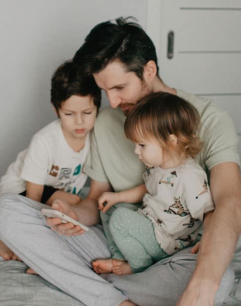 a-young-bearded-father-with-two-young-children-Pittsboro-child-support-ellis-family-law