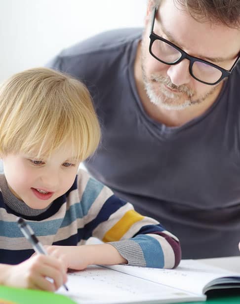 father-helping-child-do-his-homework-child-custody-lawyer-pittsboro