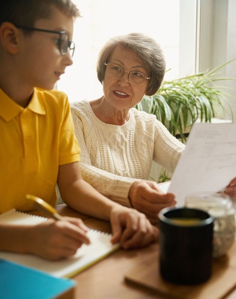 grandmother-helping-child-to-study-during-quaranti-2026-01-05-06-23-08-utc-1-1