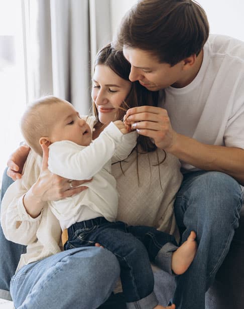 happy-family-playing-with-their-baby-son-Pittsboro-child-support-ellis-family-law