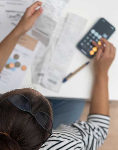 focused-woman-counts-utility-bank-bills-with-calcu-2026-01-06-09-25-54-utc-1