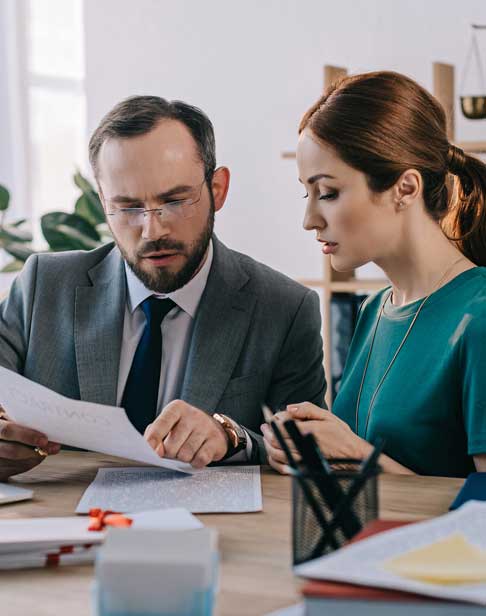 lawyer-and-client-discussing-contract-prenup-ellis-family-law