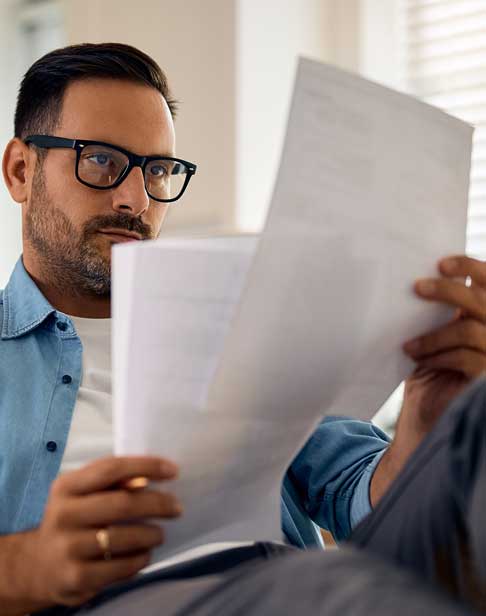 man-analyzing-business-reports-durham-alimony-lawyers-Ellis-family
