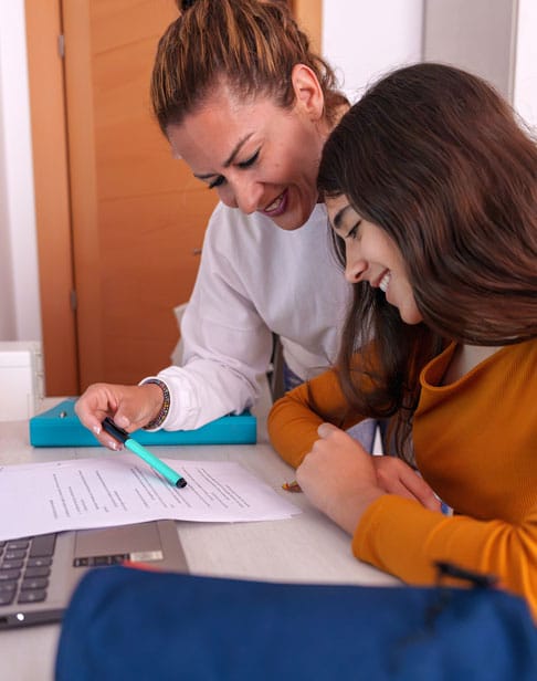mother-guiding-teenage-daughter-while-reviewing-ho-2026-01-09-12-05-29-utc-1
