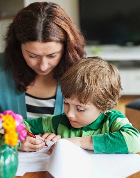 mother-sitting-by-son-doing-homework-at-home-2026-01-05-05-52-10-utc-1