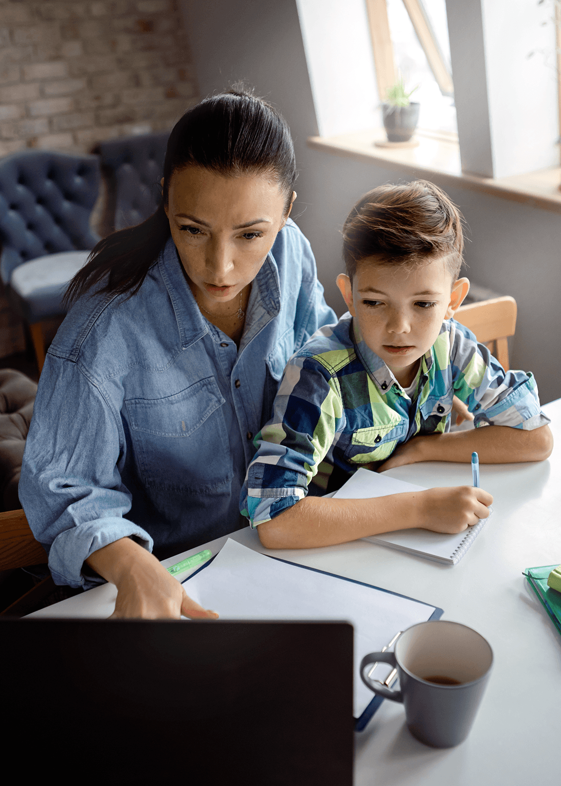 mom-helps-son-to-do-homework-child-custody-garner-nc