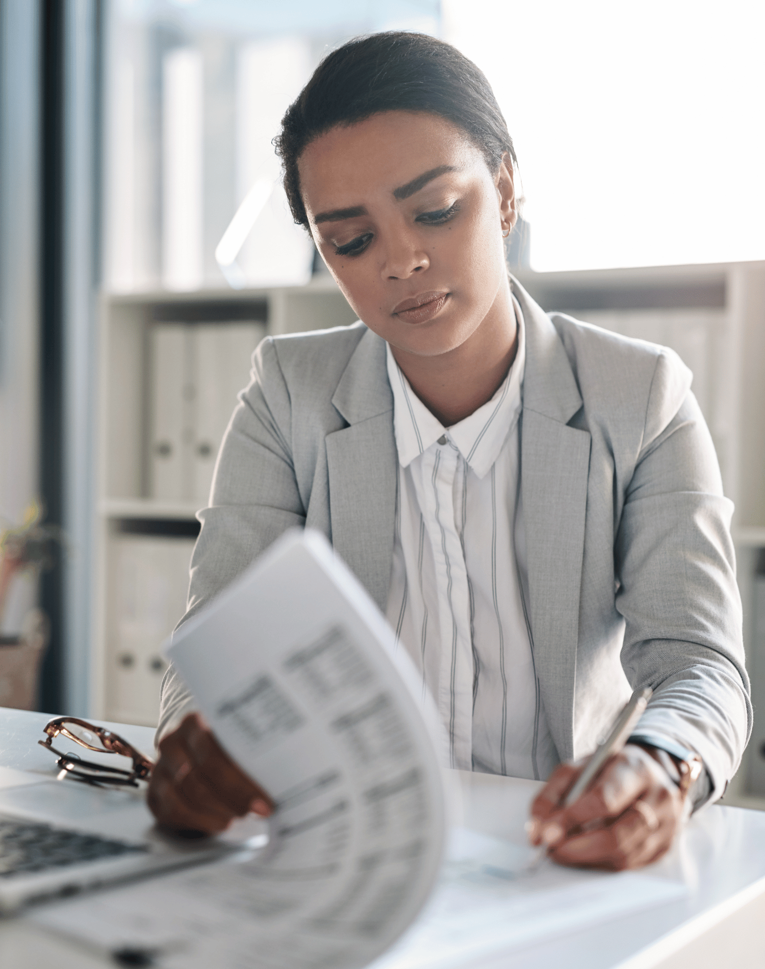 woman signing contract in conference room garner mediation