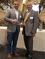 Gray Ellis receiving BBB Ethics Award in 2023