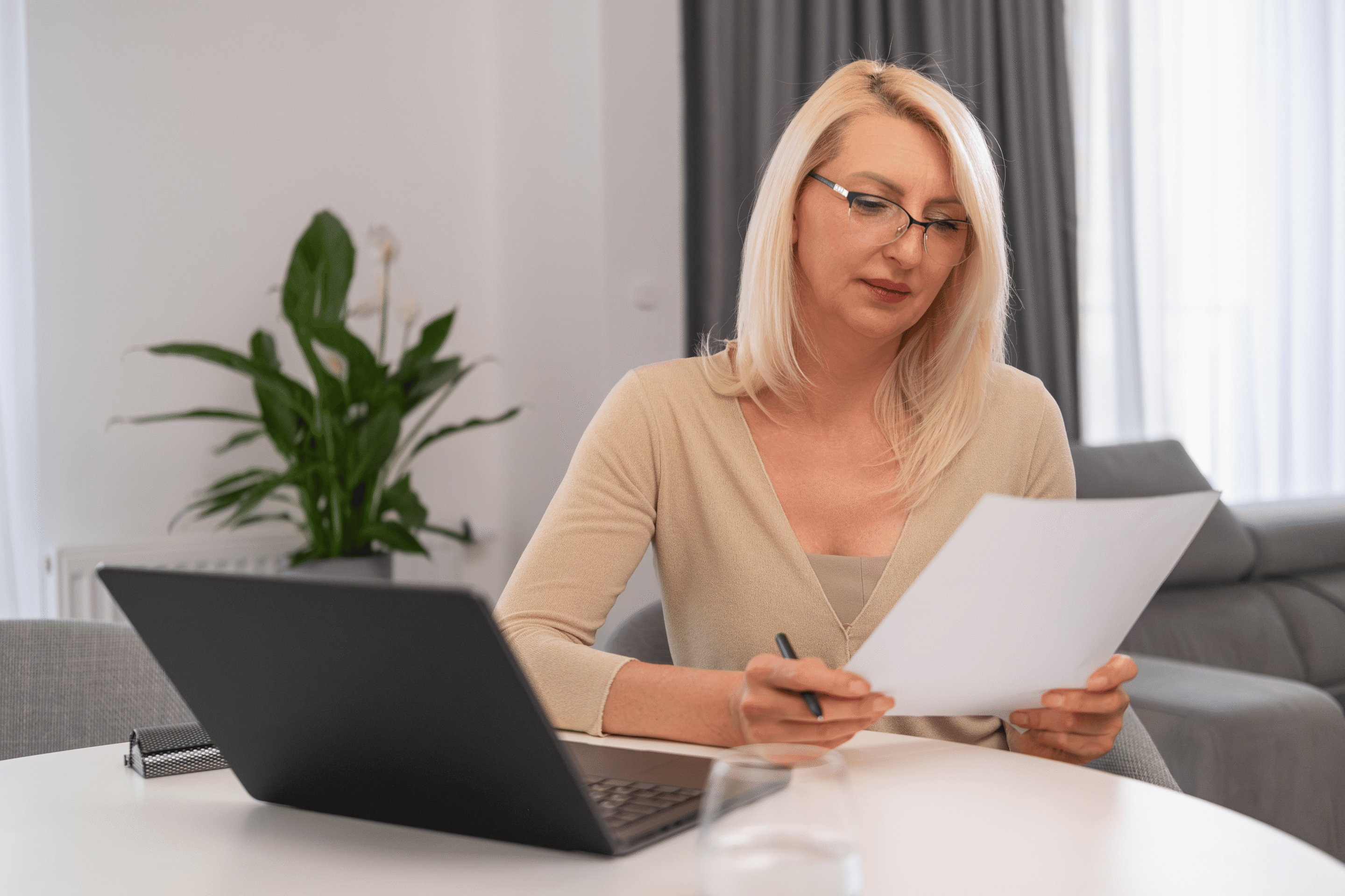woman-looking-through-a-contract-family-and-divorce-law-roxboro