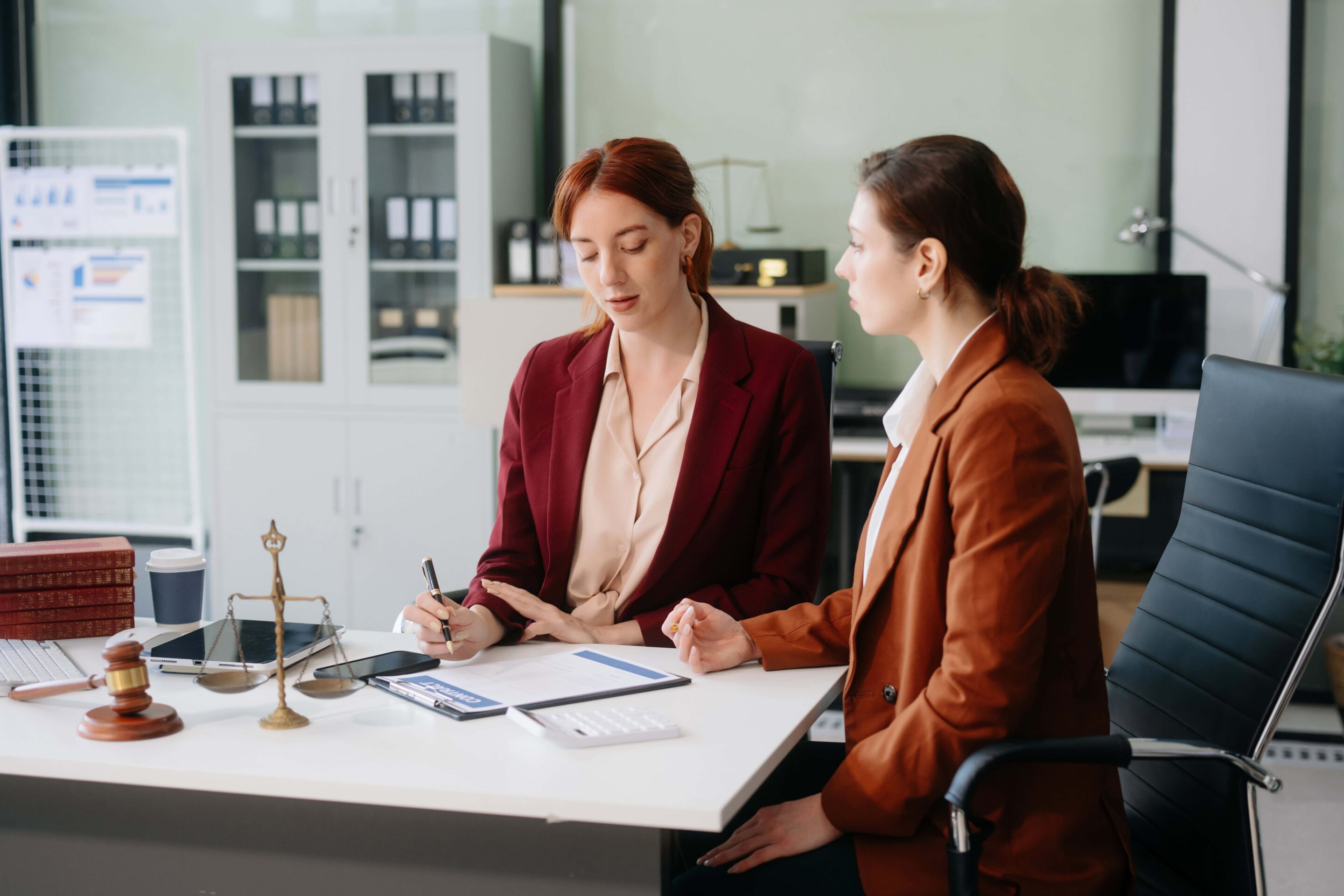 women-discussing-legal-documents_durham_divorce_lawyer